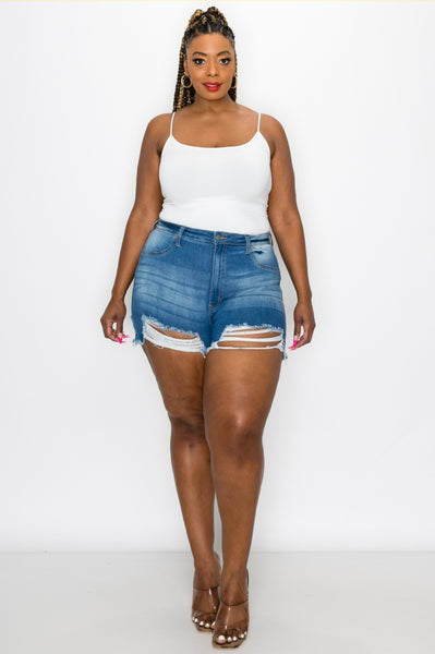 Let the sun bless your skin with the "I'm A Little Torn" Distressed Jean Shorts. These shorts have the perfect stretch and the perfect peek-a-boo leg that's sure to turn heads. Pair it with a cute tee, bodysuit or swimsuit and you'll be set to soak up the sun!   Model is Wearing: Large