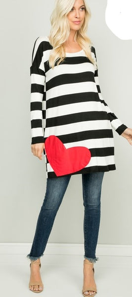 Let this "Love Below" Oversized Tunic Tee be your comfortable yet transformative piece. Go from cute to cuter with ease because this doubles as a cute midi dress....WITH POCKETS!   Model is Wearing: Small  It is truly oversized...