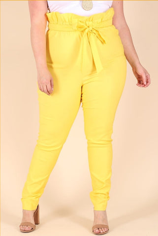 Add a little sunshine to your wardrobe with the "Bag of Sunshine" PaperSack Pant. These pants have a definite forgiving stretch and the high paper sack waist adds an on trend element for anytime!  Model is Wearing: Medium